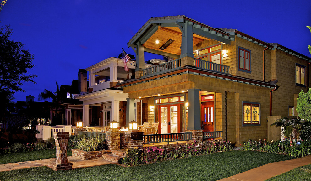Design ideas for a traditional two-storey exterior in San Diego with wood siding.