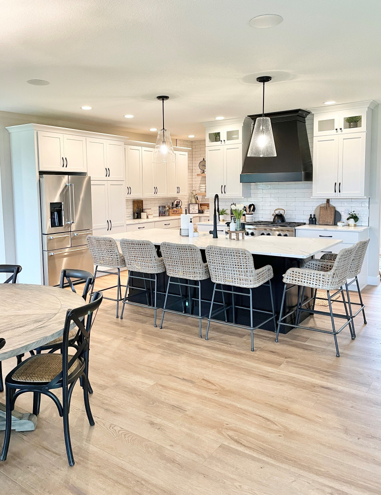 White, Black, and White Oak Open Concept Kitchen and Pantry in