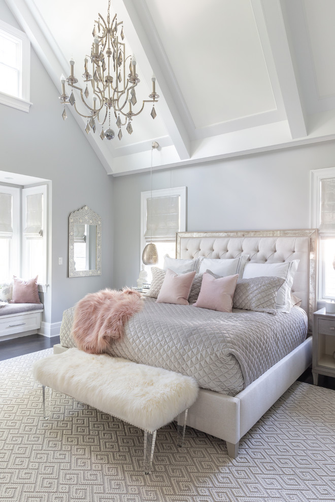 Example of a small beach style master medium tone wood floor and brown floor bedroom design in New York with gray walls