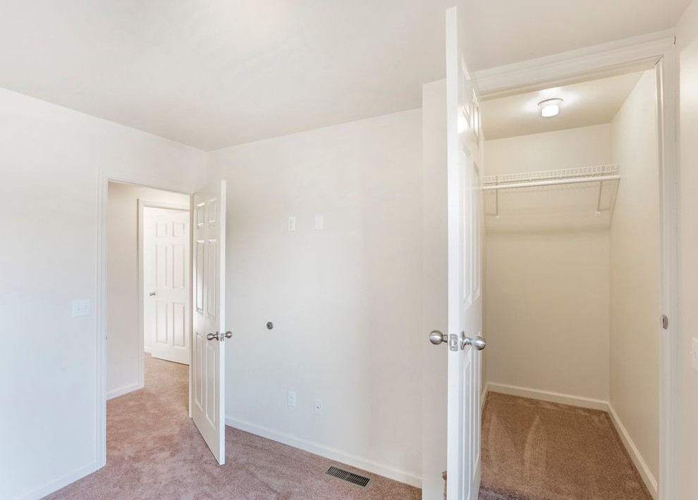 Small transitional guest carpeted and beige floor home design photo with white walls