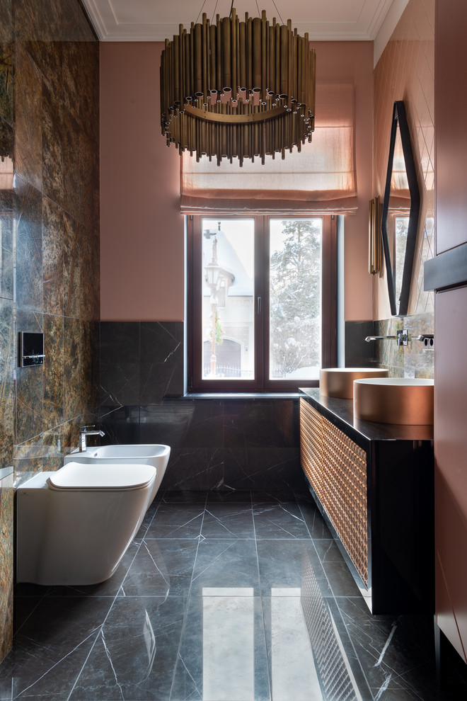Inspiration for a contemporary powder room in Other with a bidet, pink walls and grey floor.