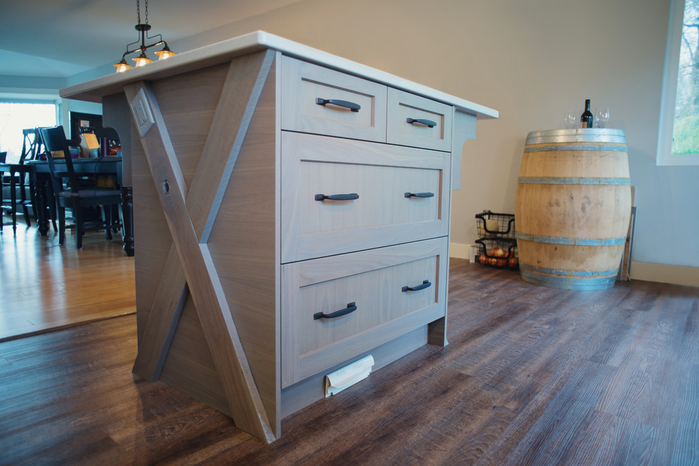 Inspiration for a mid-sized transitional l-shaped eat-in kitchen remodel in Vancouver with shaker cabinets, quartz countertops, an island and light wood cabinets