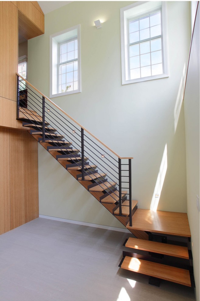 This is an example of a contemporary staircase in New York with open risers.
