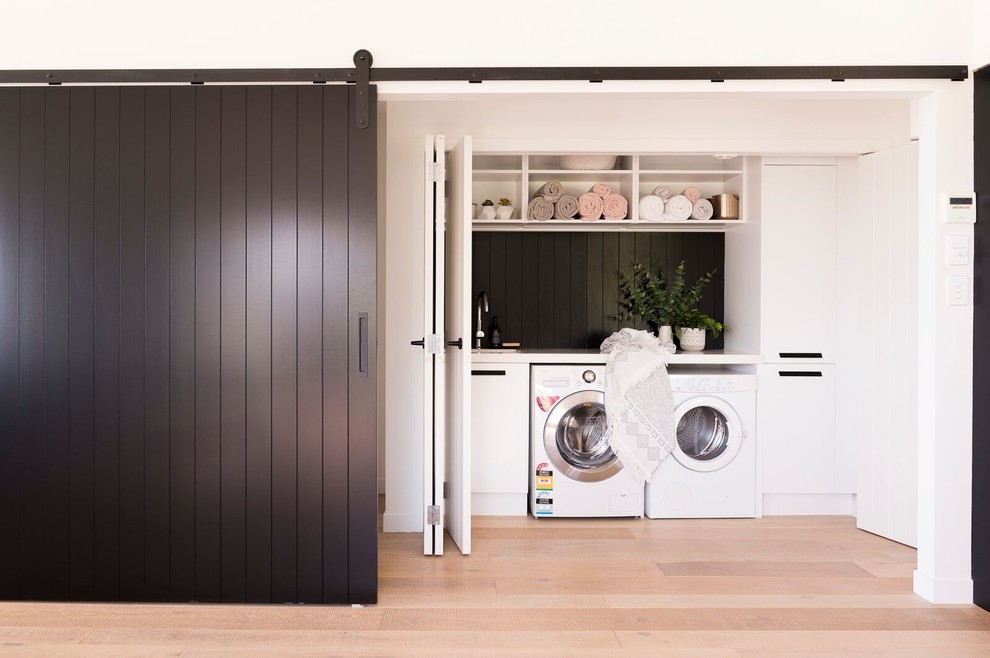 Design ideas for a contemporary laundry room in Auckland.