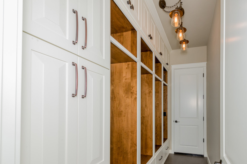 Photo of a small transitional mudroom in Portland with beige walls, a single front door and a white front door.