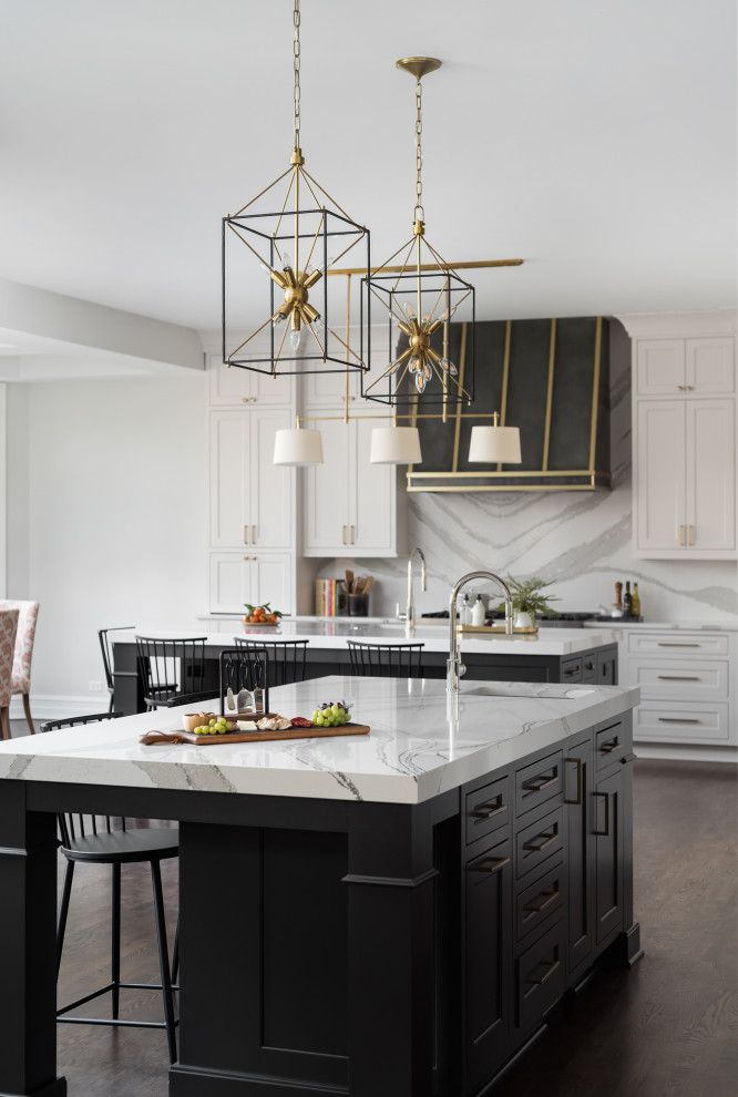 Inspiration for a large transitional l-shaped open plan kitchen in Chicago with an undermount sink, flat-panel cabinets, white cabinets, quartz benchtops, white splashback, engineered quartz splashback, panelled appliances, dark hardwood floors, multiple islands, brown floor, white benchtop and coffered.