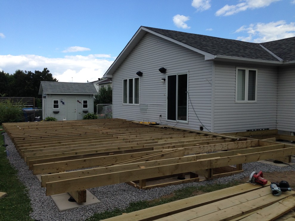 Huge transitional backyard deck photo