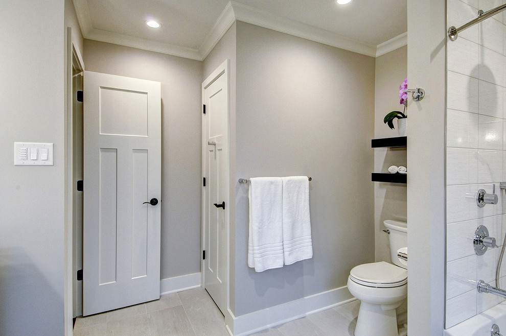Mid-sized modern bathroom in Philadelphia with flat-panel cabinets, dark wood cabinets, an alcove tub, a shower/bathtub combo, a two-piece toilet, white walls, porcelain floors, an integrated sink, marble benchtops, white floor and a shower curtain.