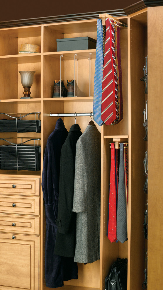 Photo of a traditional men's walk-in wardrobe in Orange County with raised-panel cabinets and light wood cabinets.