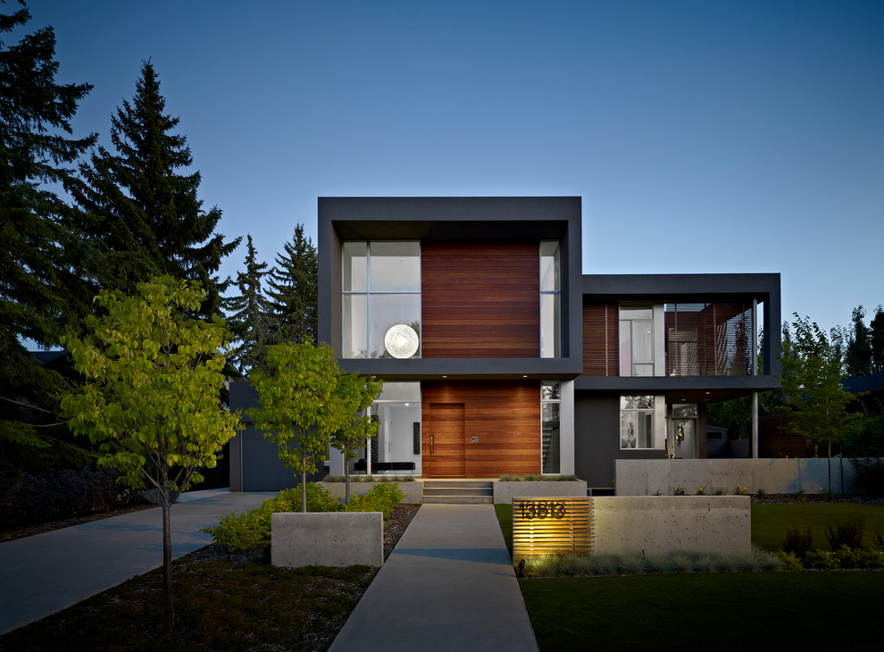 This is an example of a modern exterior in Edmonton with wood siding.