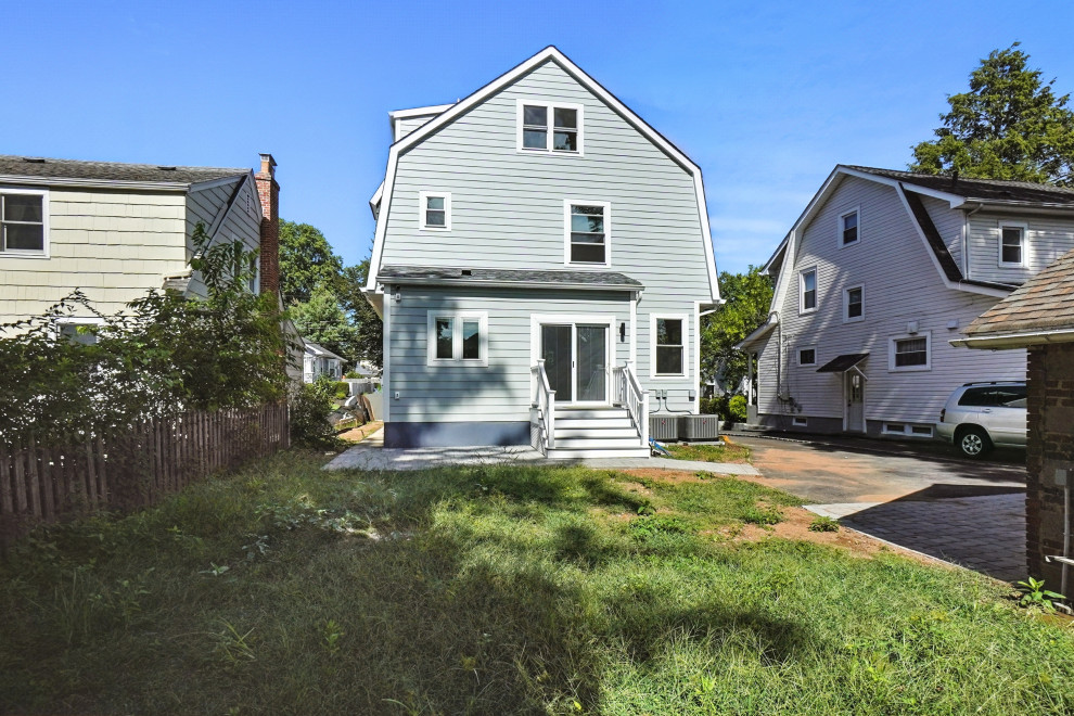 Rear Exterior with Backyard and Gambrel Roof