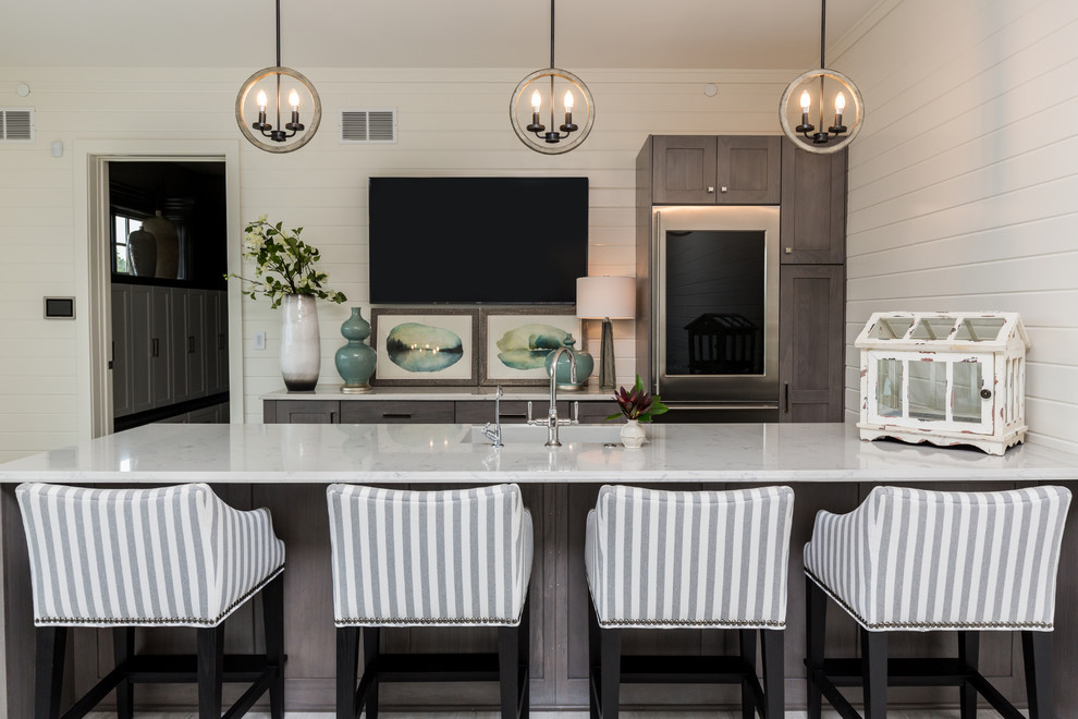 Photo of a transitional u-shaped home bar in Other with a drop-in sink, flat-panel cabinets, grey cabinets, marble benchtops, painted wood floors and white benchtop.