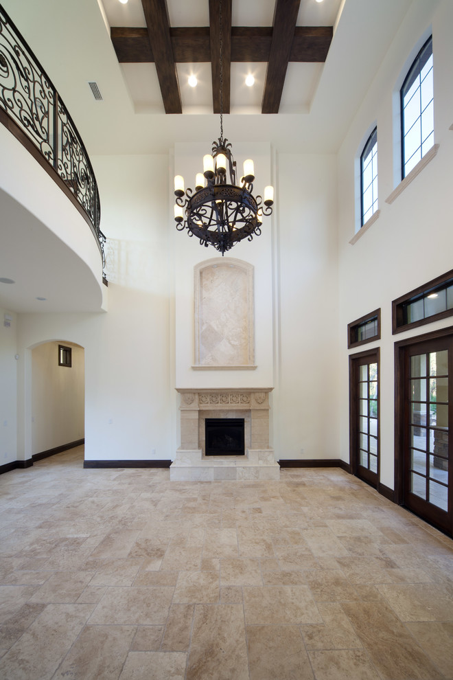 Large mediterranean formal open concept living room in Orlando with beige walls, a standard fireplace, a stone fireplace surround and no tv.
