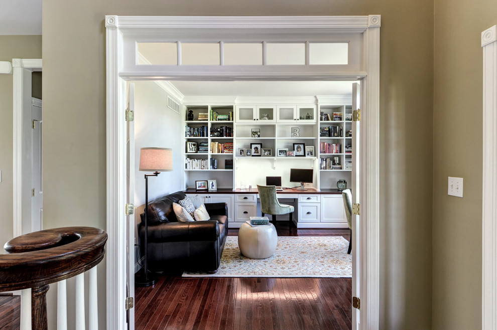 Example of a mid-sized transitional built-in desk medium tone wood floor study room design in Philadelphia with gray walls