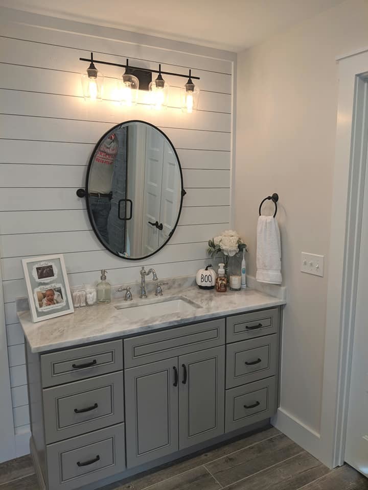 This is an example of a mid-sized country master bathroom in Raleigh with flat-panel cabinets, grey cabinets, a freestanding tub, a corner shower, gray tile, porcelain tile, grey walls, porcelain floors, an undermount sink, marble benchtops, grey floor, a hinged shower door and yellow benchtops.