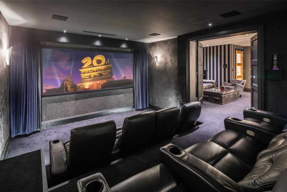 Contemporary enclosed home theatre in London with grey walls, carpet, a wall-mounted tv and blue floor.