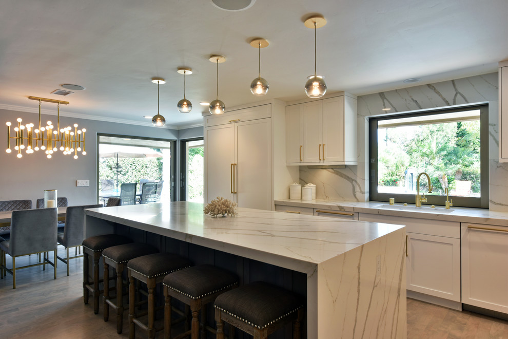 Design ideas for an expansive transitional l-shaped open plan kitchen in San Diego with shaker cabinets and with island.