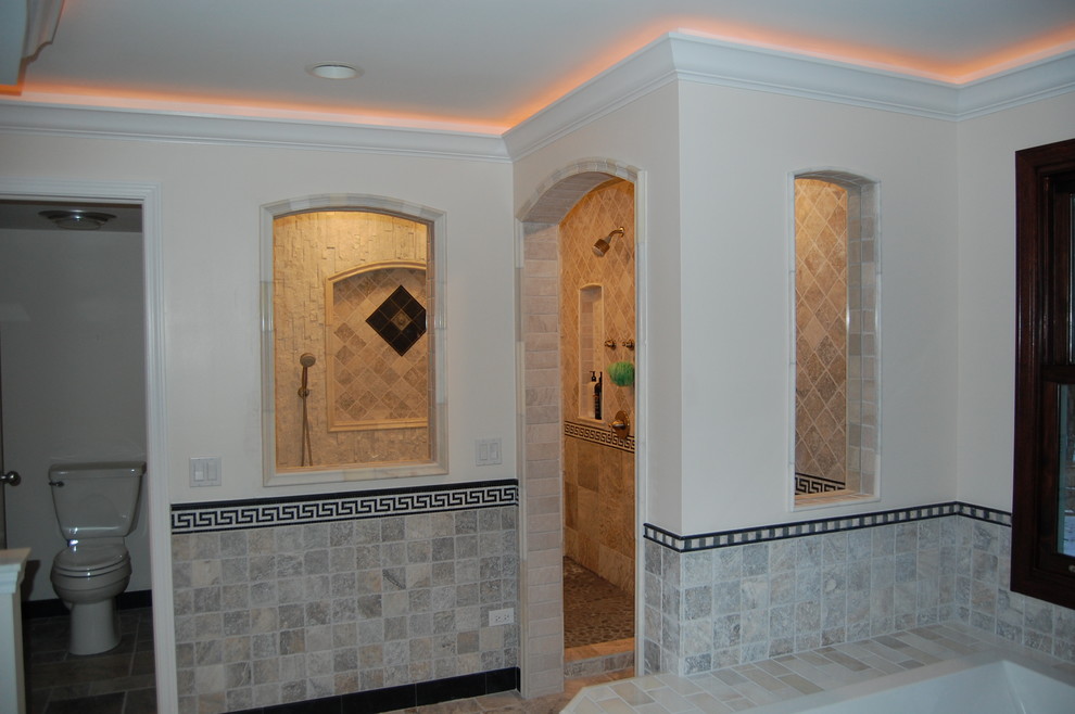 Drop-in bathtub - large transitional master multicolored tile and stone tile marble floor drop-in bathtub idea in Chicago with flat-panel cabinets, dark wood cabinets, marble countertops, a two-piece toilet, an undermount sink and beige walls