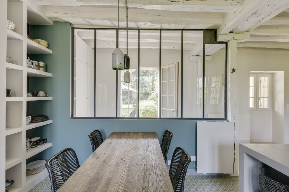 Inspiration for a large industrial separate dining room in Paris with green floor.