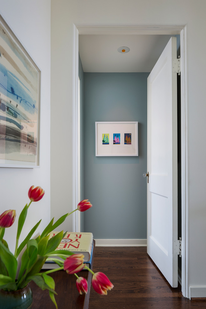 Inspiration for a mid-sized transitional hallway in Kansas City with grey walls and dark hardwood floors.