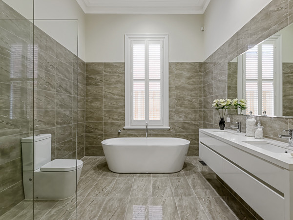 Design ideas for a contemporary master bathroom in Melbourne with white cabinets, a corner shower, a one-piece toilet, gray tile and grey walls.
