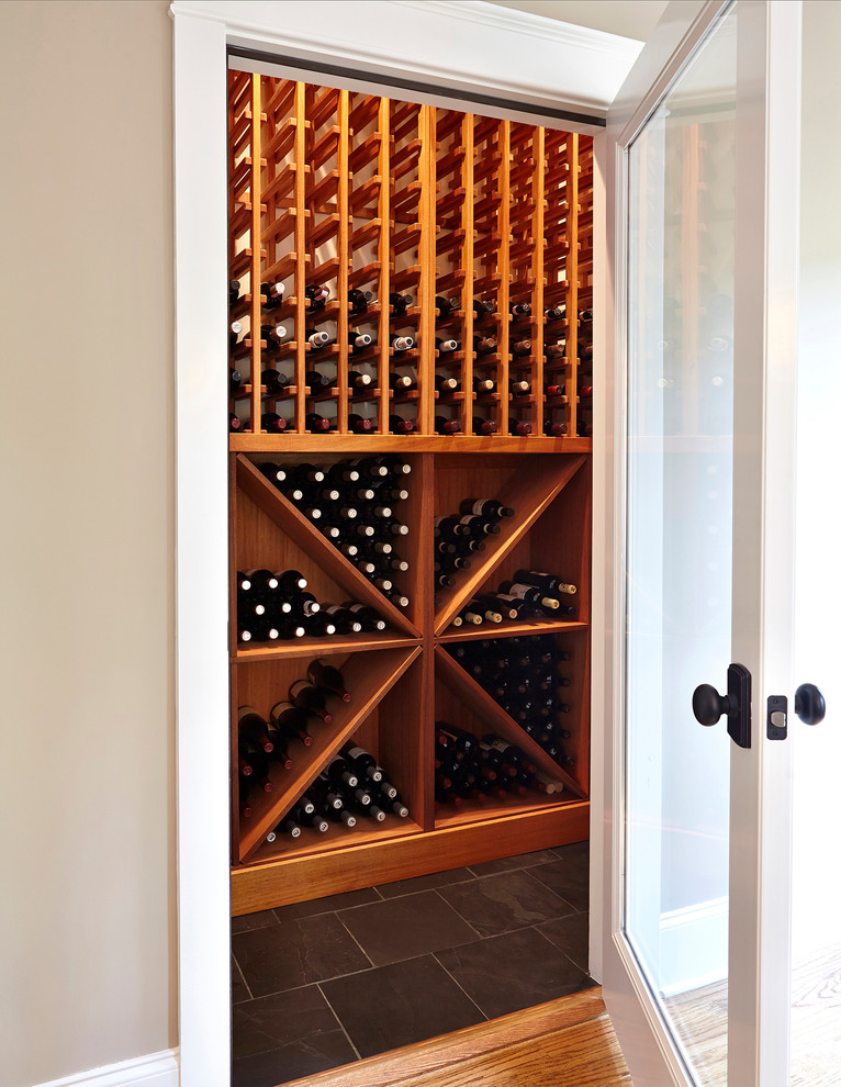Small contemporary wine cellar in Seattle with slate floors and storage racks.
