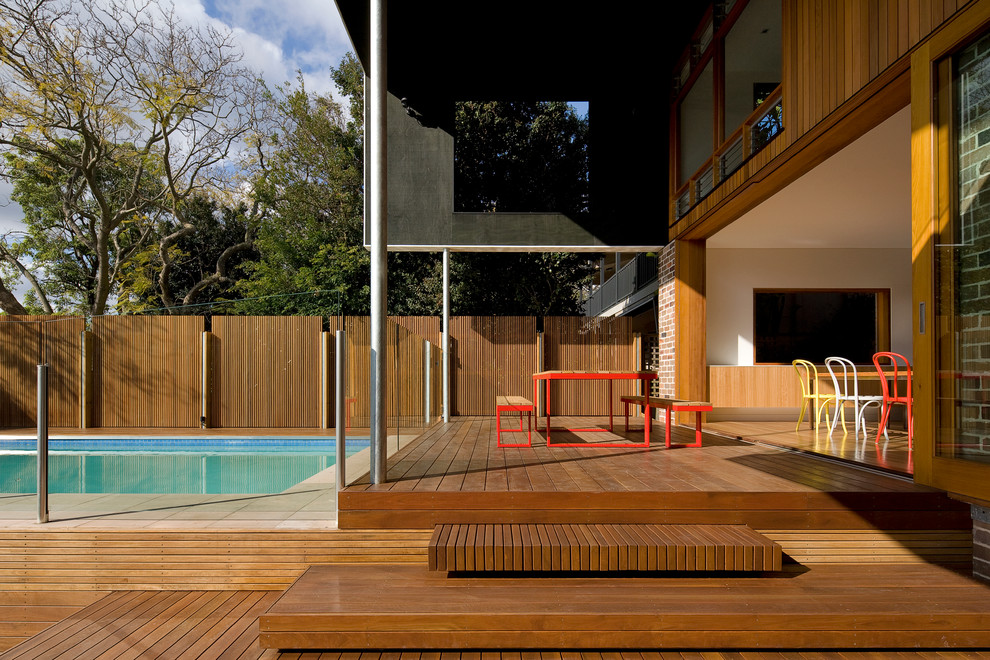 Design ideas for a mid-sized contemporary backyard patio in Sydney with a pergola and decking.