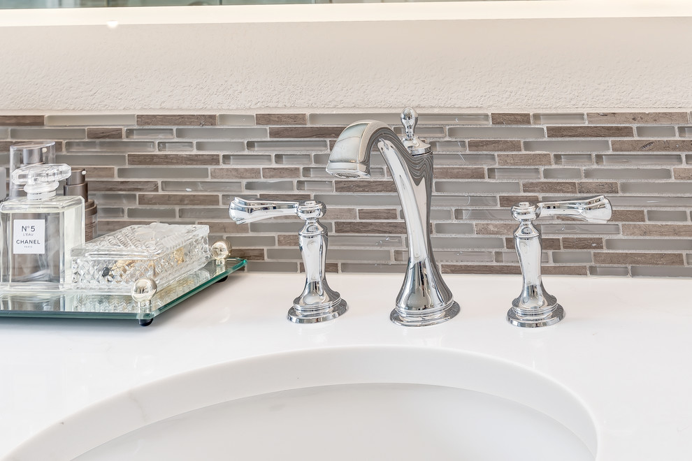 Inspiration for a mid-sized transitional master gray tile and porcelain tile porcelain tile and gray floor freestanding bathtub remodel in Boise with shaker cabinets, white cabinets, a two-piece toilet, gray walls, an undermount sink, quartz countertops and a hinged shower door