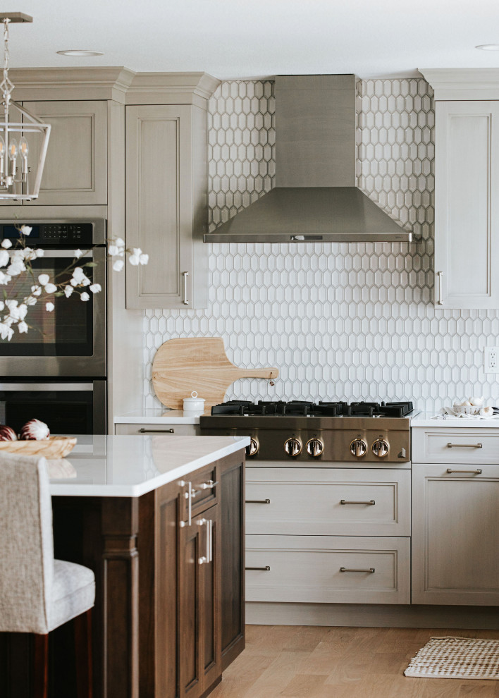 Example of a transitional kitchen design in Denver