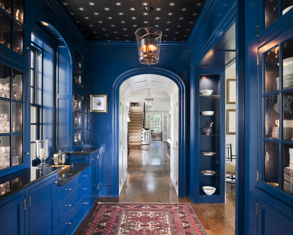 Large traditional hallway in Philadelphia with blue walls and medium hardwood floors.