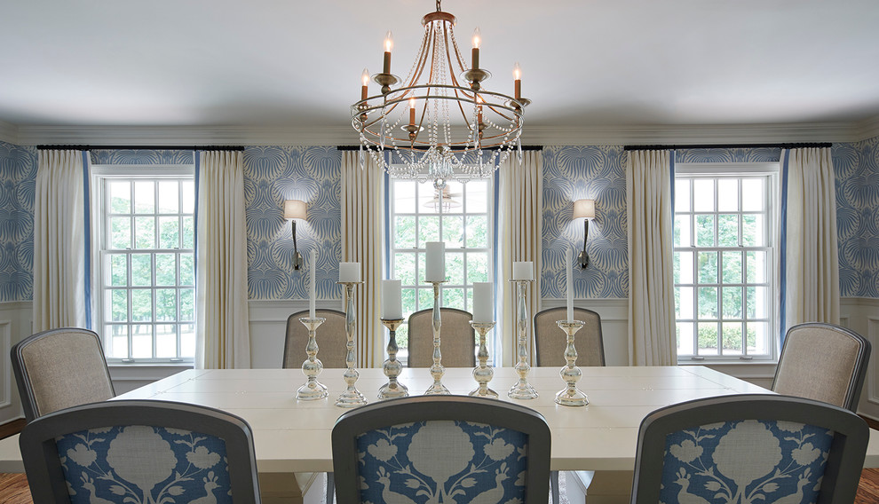 Design ideas for a traditional dining room in New York with blue walls, no fireplace, brown floor and dark hardwood floors.