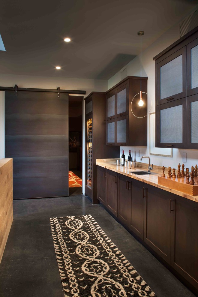 Inspiration for a large country single-wall home bar in Other with an undermount sink, dark wood cabinets and shaker cabinets.