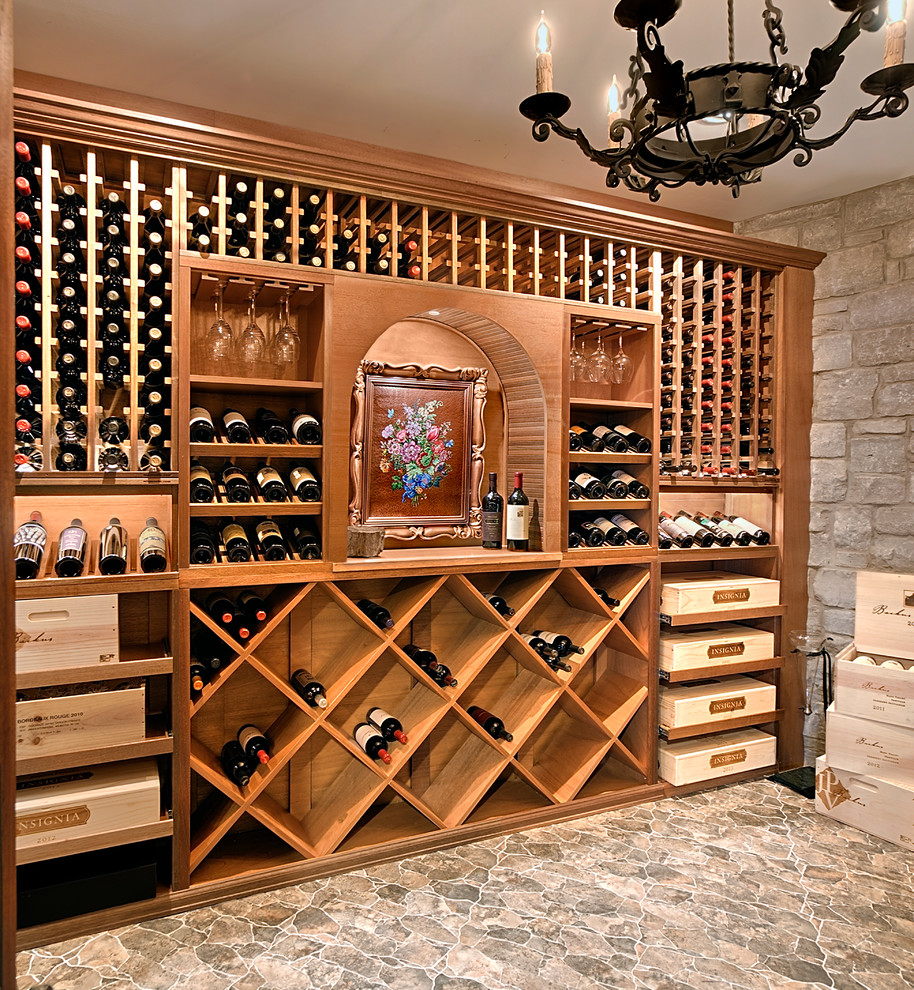Design ideas for a mid-sized mediterranean wine cellar in Chicago with storage racks, brown floor and ceramic floors.