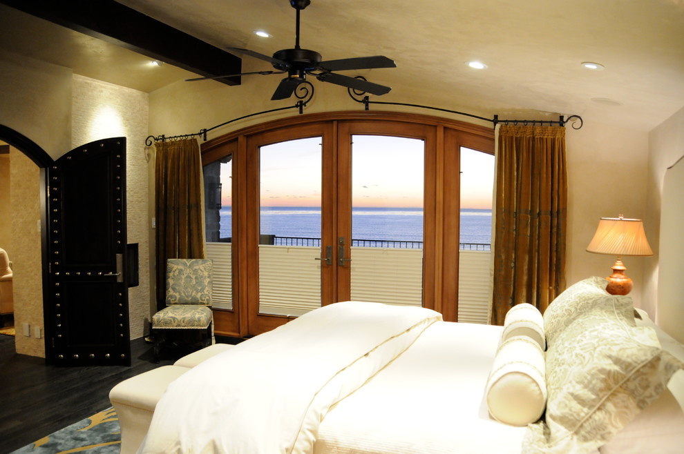 This is an example of a mid-sized traditional master bedroom in San Diego with beige walls, dark hardwood floors and no fireplace.