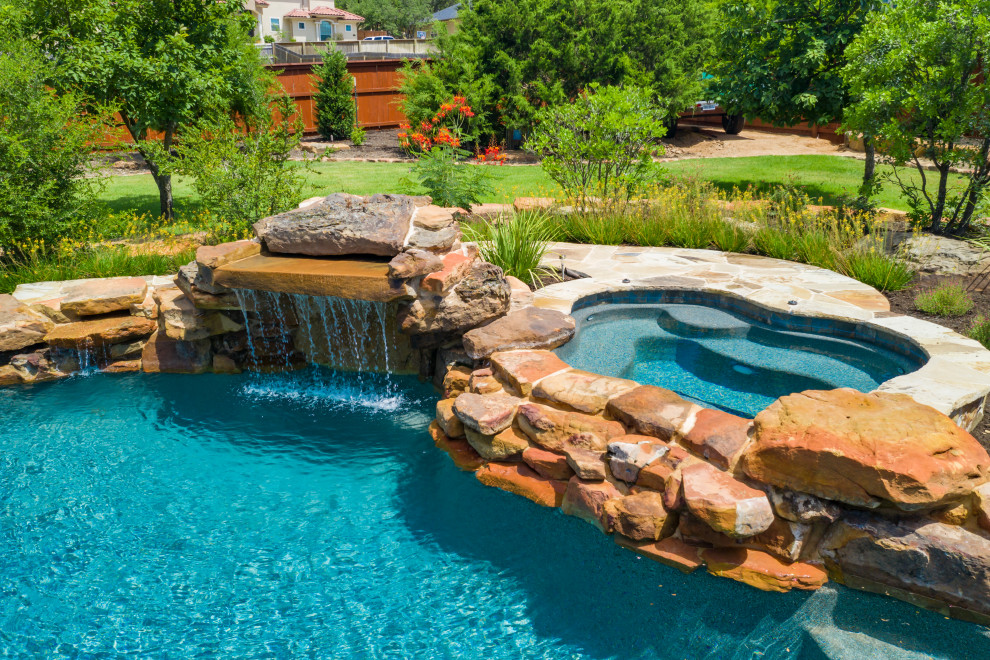 Inspiration for a rustic backyard custom-shaped natural pool remodel