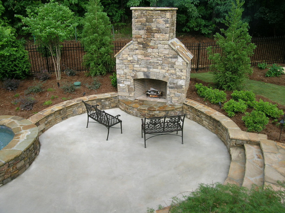 Inspiration for a mid-sized traditional backyard patio in Atlanta with a fire feature, concrete pavers and no cover.