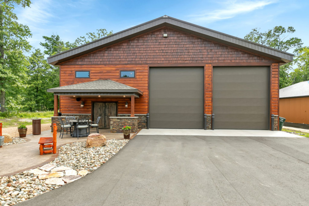 This is an example of a brown rustic two floor house exterior in Minneapolis with mixed cladding and a brown roof.