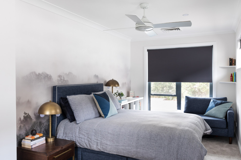 This is an example of a mid-sized contemporary guest bedroom in Sydney with carpet, white walls, no fireplace and grey floor.