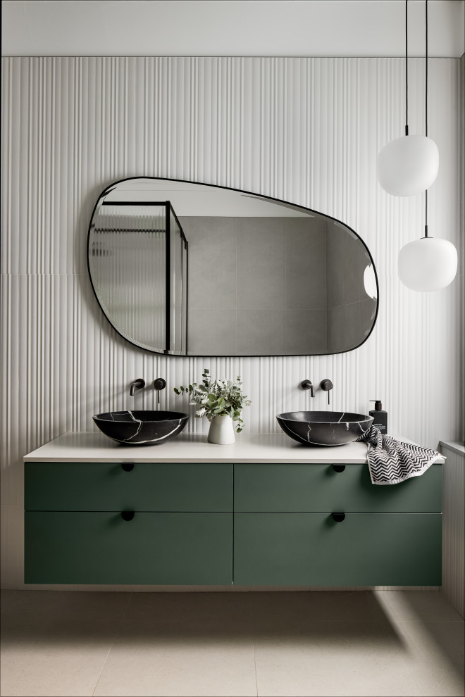 Photo of a large contemporary master bathroom in Sydney with white tile, porcelain tile, porcelain floors, engineered quartz benchtops, grey floor, a double vanity, a floating vanity, flat-panel cabinets, green cabinets, a vessel sink and white benchtops.