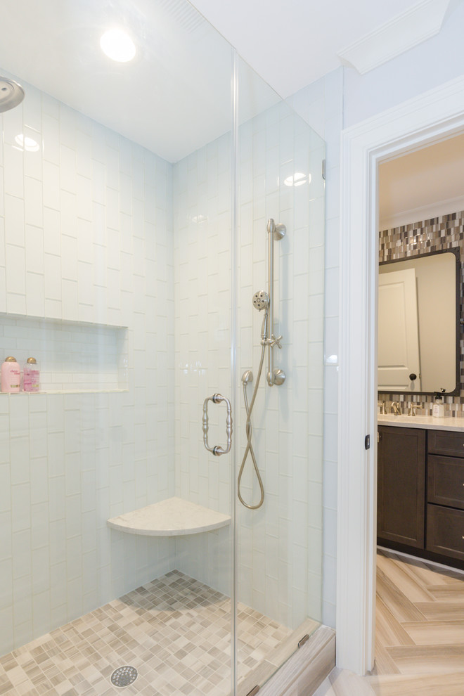 Design ideas for a large transitional kids bathroom in Charlotte with recessed-panel cabinets, dark wood cabinets, a curbless shower, a two-piece toilet, brown tile, mosaic tile, white walls, ceramic floors, an undermount sink and quartzite benchtops.
