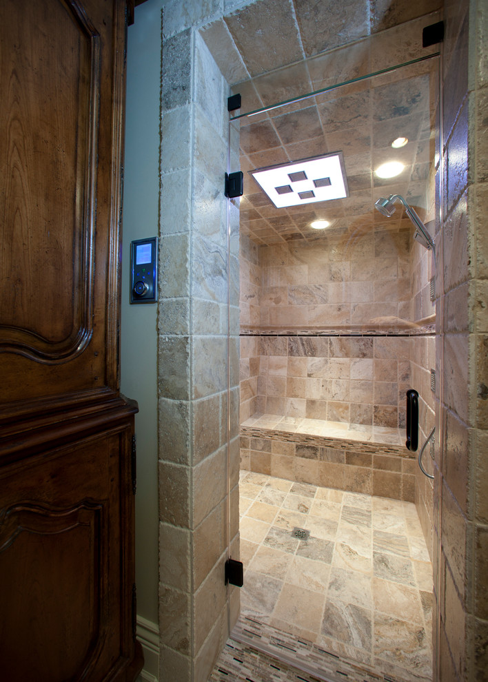 Freestanding bathtub - small rustic master beige tile and porcelain tile porcelain tile and beige floor freestanding bathtub idea with raised-panel cabinets, dark wood cabinets, beige walls, a drop-in sink and granite countertops