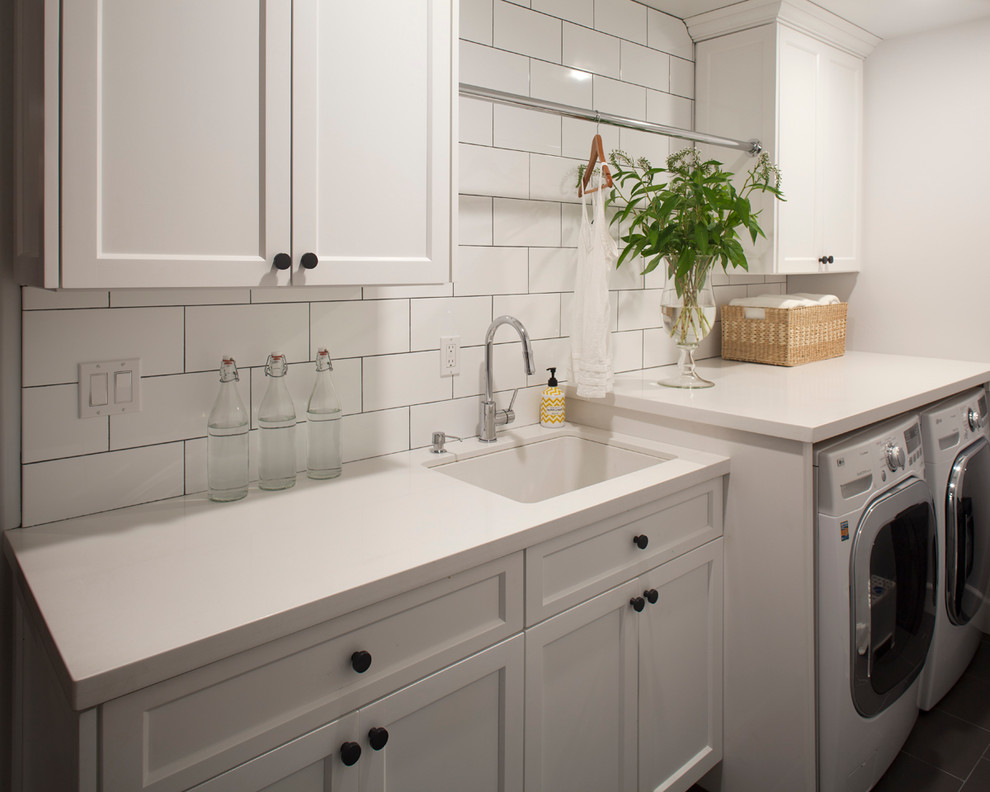 Photo of a mediterranean laundry room in San Diego with white benchtop.