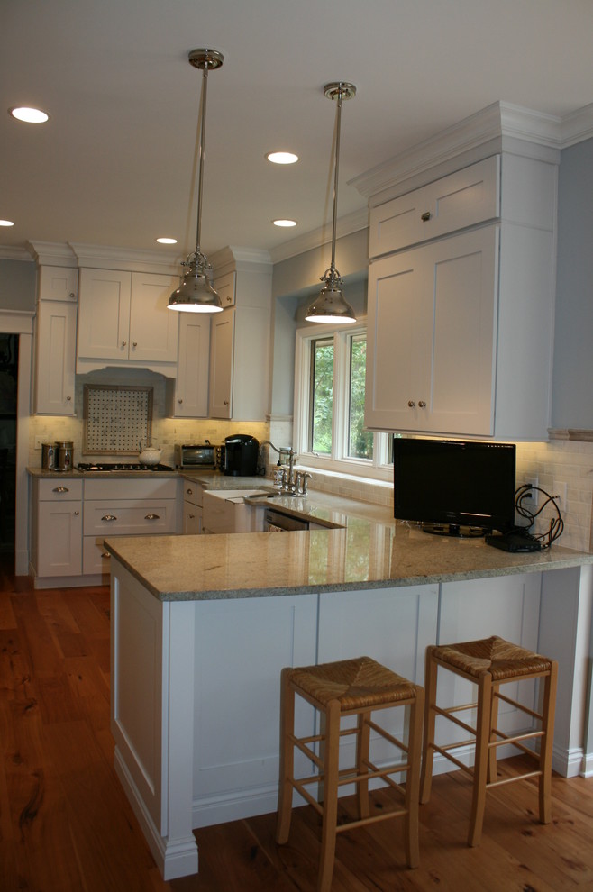 Transitional kitchen photo in Nashville with flat-panel cabinets, white cabinets and granite countertops
