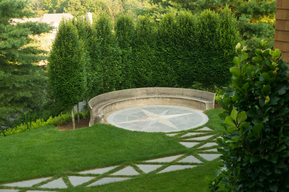 Patio - mid-sized transitional backyard stone patio idea in New York with no cover
