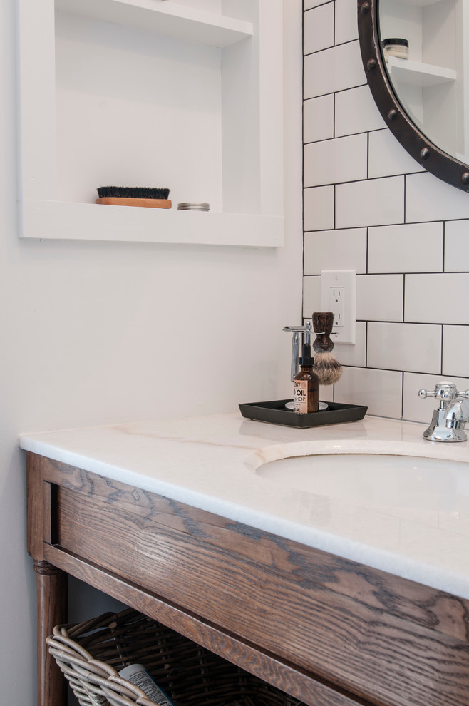 Inspiration for a mid-sized country master bathroom in New York with a drop-in sink, marble benchtops, white tile, subway tile, white walls, ceramic floors, open cabinets, medium wood cabinets, a freestanding tub, an open shower and a two-piece toilet.