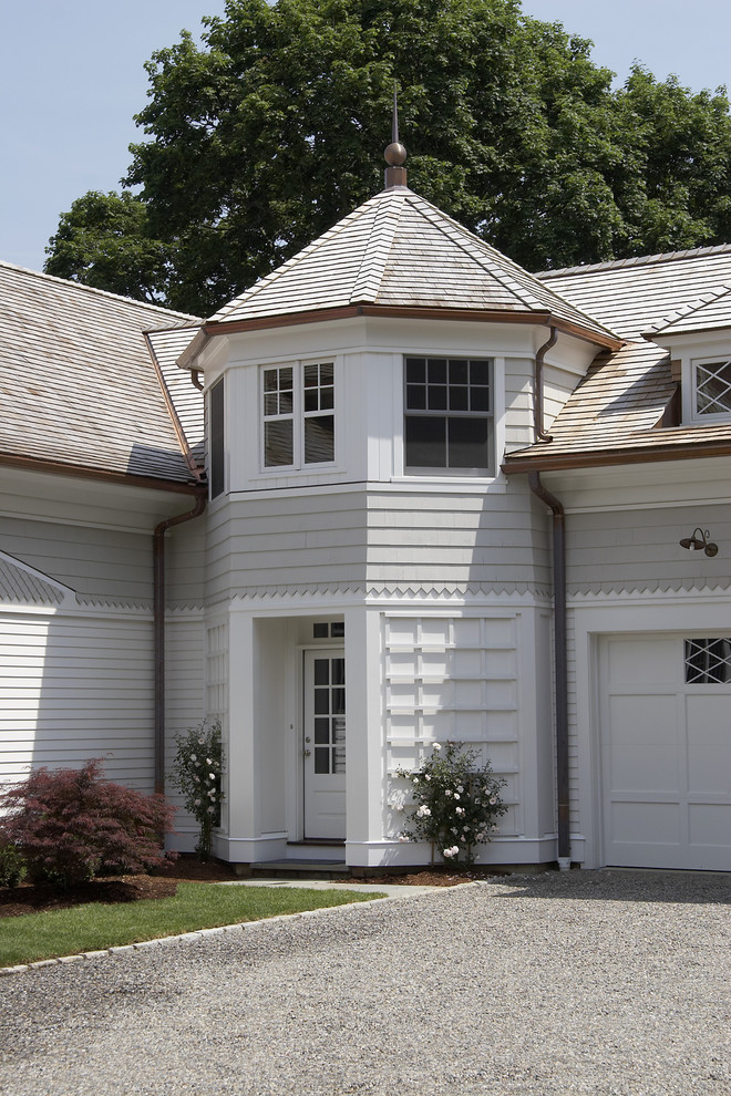 Inspiration for a large traditional two-storey grey exterior in New York with vinyl siding and a gable roof.