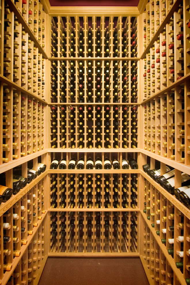 Design ideas for a contemporary wine cellar in Brisbane with cork floors and display racks.