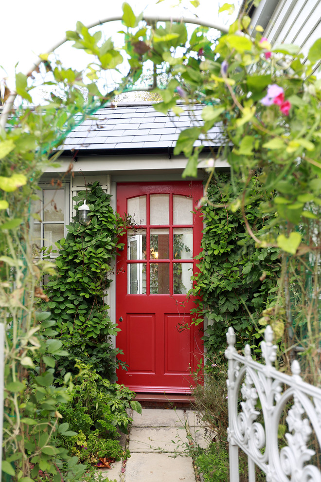 Traditional front door in London with a single front door and a red front door.