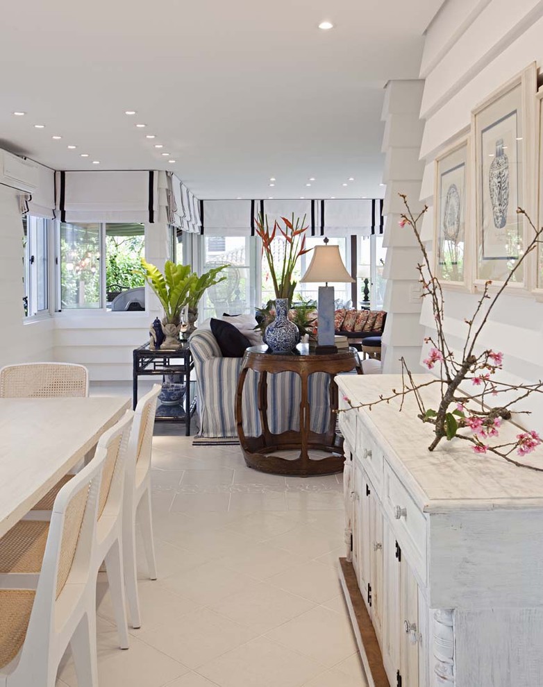 Photo of a beach style dining room in Other with white walls.