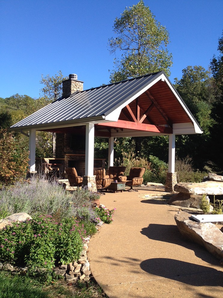 Inspiration for a mid-sized traditional backyard patio in Other with a fire feature, gravel and a gazebo/cabana.